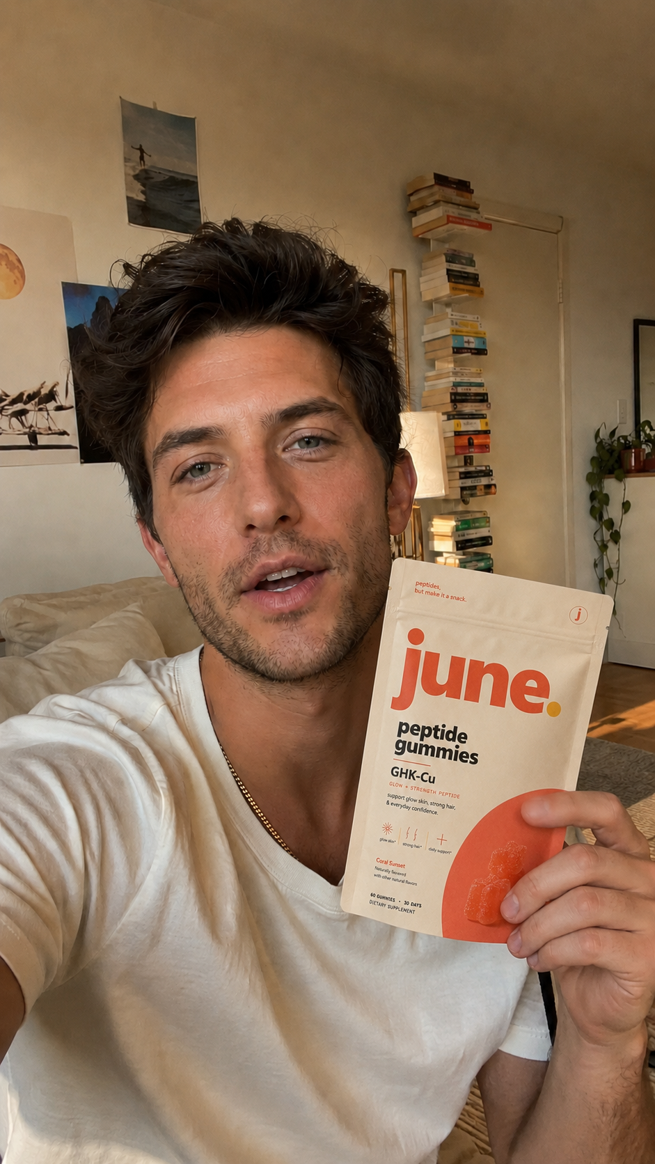 Creator holding a June pouch in a living-room selfie